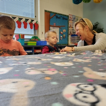 Students making blankets for My Very Own Blanket Organization.